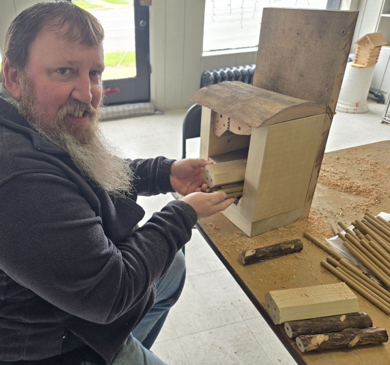 Starting to place bee blocks and tubes into the rustic bee hotel