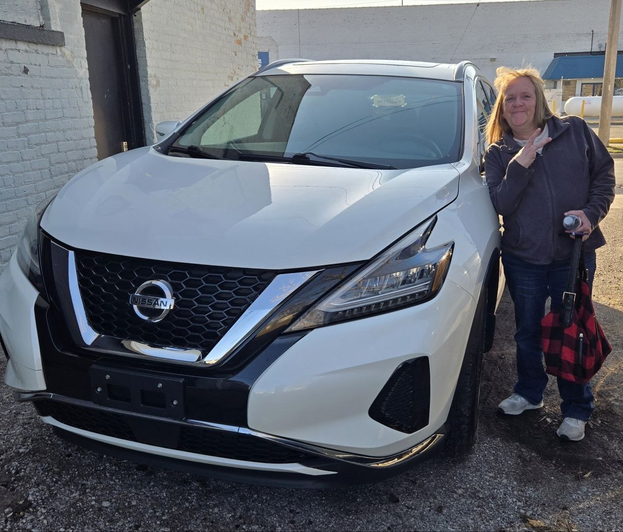 Vanessa with the new vehicle after truck problems forced a big purchase before cabin season