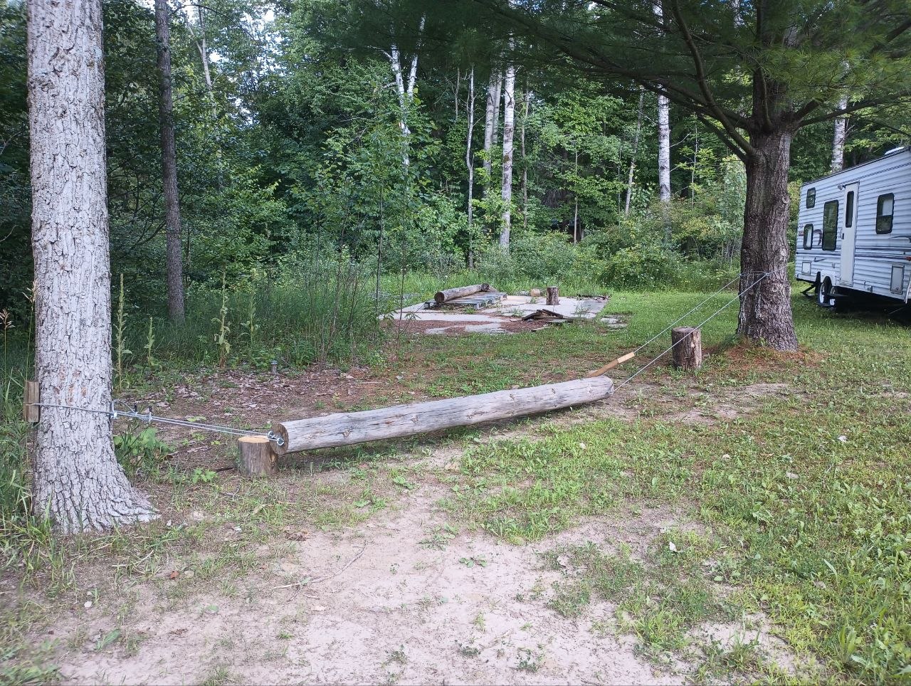 Homemade swinging balance beam made for the grandkids at the cabin